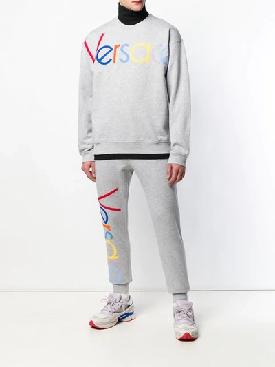 Shop Versace Embroidered Logo Joggers In Grey