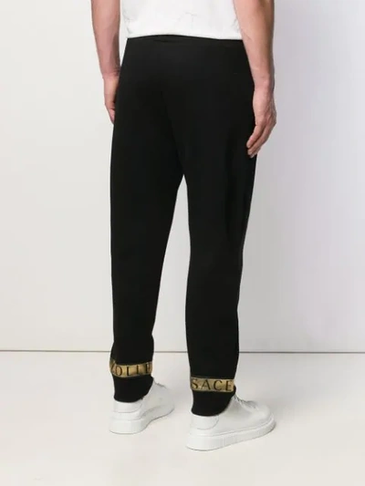 Shop Versace Foiled Logo Trim Joggers In Black