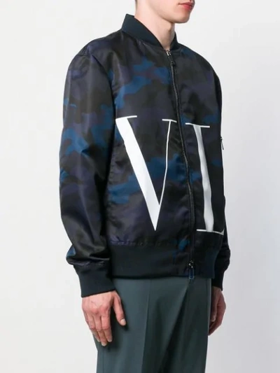 Shop Valentino Vltn Camouflage Print Bomber Jacket In Blue