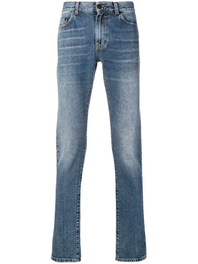 Shop Saint Laurent Tapered Jeans In Blue