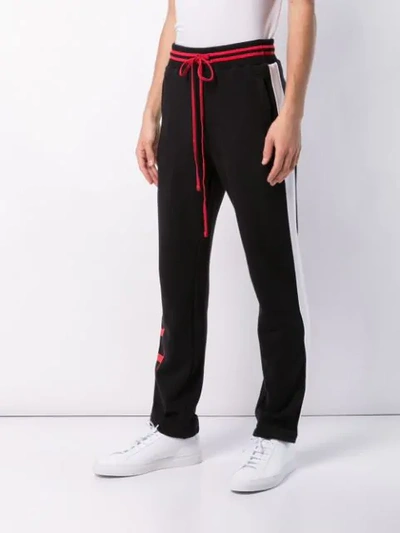 Shop Amiri Side Stripe Track Pants In Black