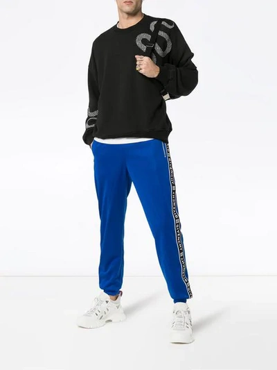 Shop Givenchy Logo Stripe Track Pants In Blue