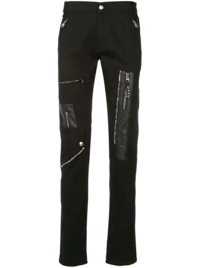Shop Alexander Mcqueen Zip Patched Trousers - Black
