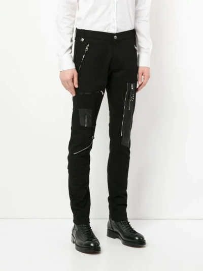 Shop Alexander Mcqueen Zip Patched Trousers - Black