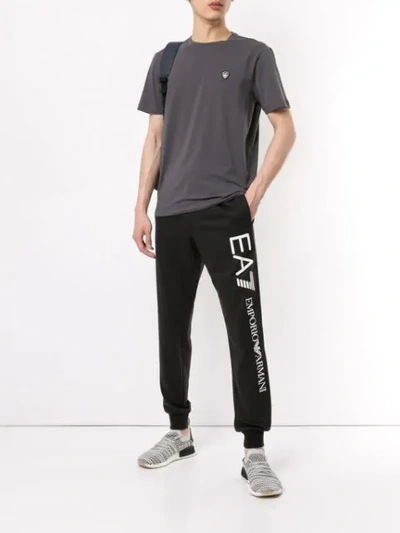 Shop Ea7 Logo Track Pants In Black