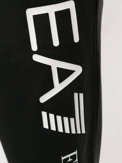 Shop Ea7 Logo Track Pants In Black