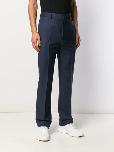 Shop Prada Logo Patch Tailored Trousers In F0r60 Divisa