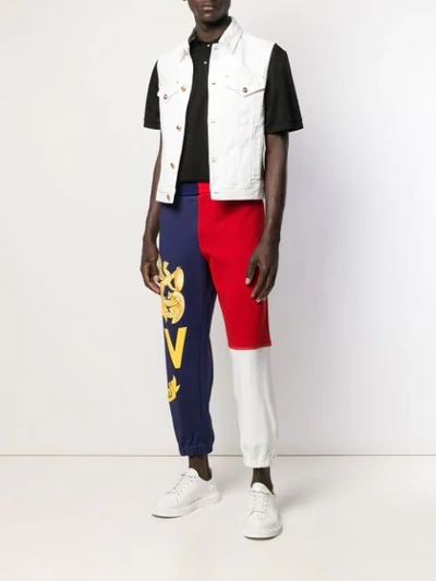 Shop Versace Crest Logo Track Pants In Blue