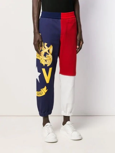 Shop Versace Crest Logo Track Pants In Blue