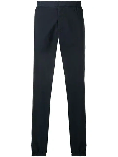 Shop Moschino Tapered Leg Trousers In Blue