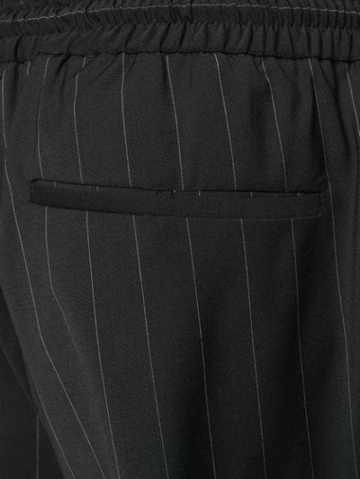 Shop Juunj Pinstriped Cargo Trousers In Black