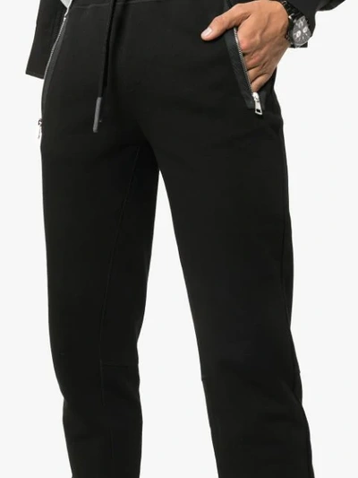 Shop Moncler Zipped Pocket Cotton Sweatpants - Black