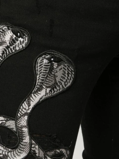 Shop Amiri Snake Patch Jeans In Black