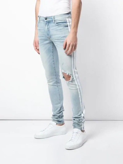 Shop Amiri Ripped Skinny Jeans In Blue