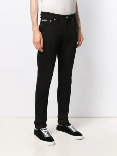 Shop Versace Jeans Couture Embroidered Logo Slim-fit Jeans In Black