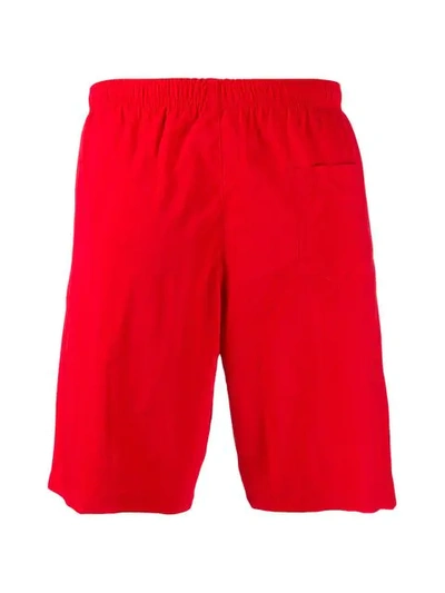 Shop Moschino Logo Track Shorts In Red