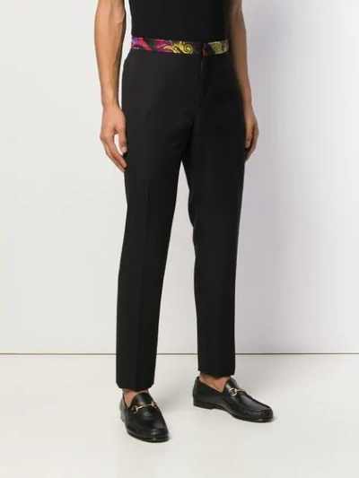 Shop Versace Printed Belt Tailored Trousers - Black