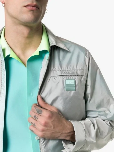 Shop Prada Logo Patch Lightweight Jacket In Grey