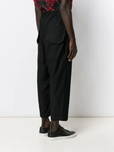 Shop Yohji Yamamoto Loose Cropped Trousers In Black
