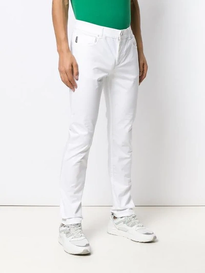 Shop Moschino Slim-fit Trousers In 0001 White
