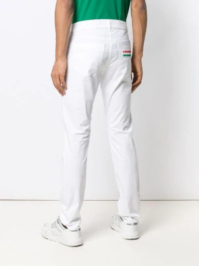 Shop Moschino Slim-fit Trousers In 0001 White