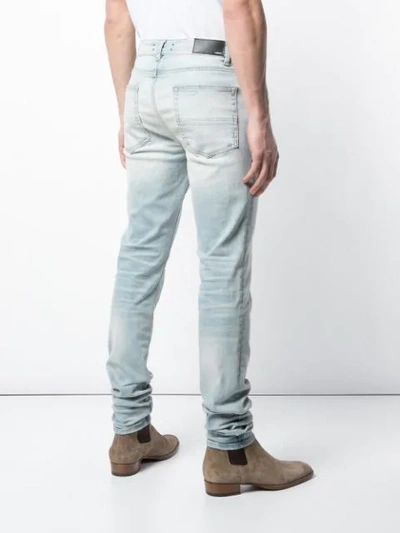 Shop Amiri Low Rise Skinny Jeans In Blue