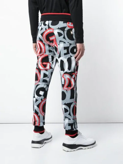 Shop Dolce & Gabbana Logo Print Track Pants In Black