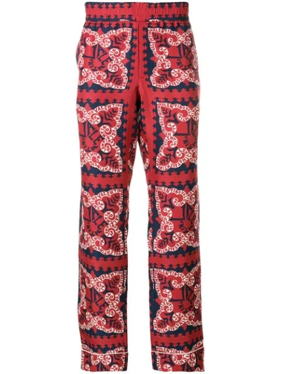 Shop Valentino Bandana Print Trousers In Red