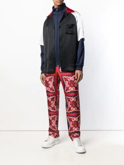 Shop Valentino Bandana Print Trousers In Red