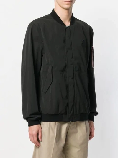 Shop Moncler Logo Patch Bomber Jacket In Black