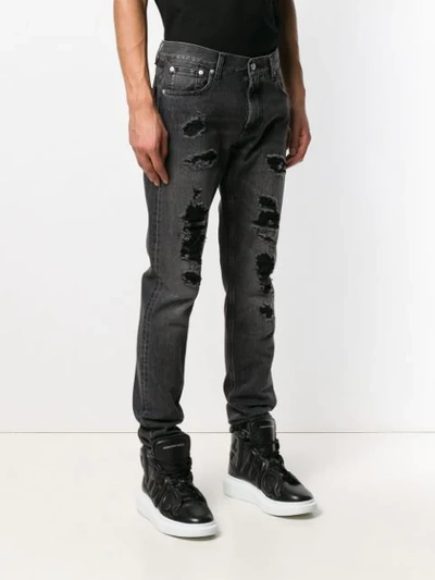 Shop Alexander Mcqueen Distressed Straight Cut Jeans In Black