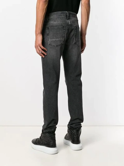 Shop Alexander Mcqueen Distressed Straight Cut Jeans In Black