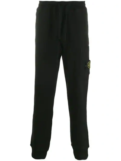 Shop Stone Island Logo Fleece Trousers - Black