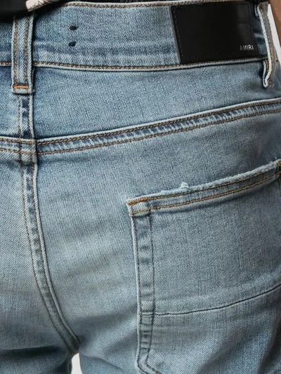 Shop Amiri Mx1 Distressed Slim-fit Jeans In Blue