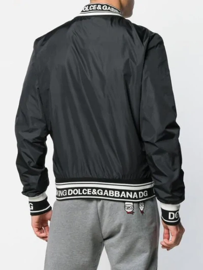 Shop Dolce & Gabbana Patch Bomber Jacket In Black