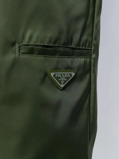 Shop Prada Logo Cropped Trousers In Green