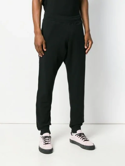 Shop Moschino Side-striped Tapered Track Pants In Black