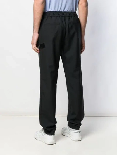 Shop Versus Regular Tapered Trousers In Black