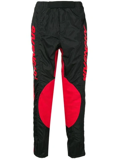 Shop Givenchy Track Style Logo Trousers In Black