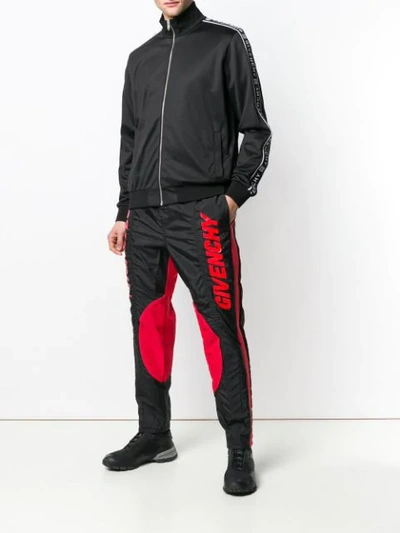 Shop Givenchy Track Style Logo Trousers In Black