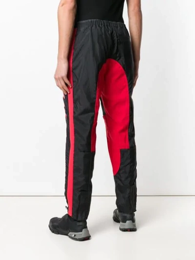 Shop Givenchy Track Style Logo Trousers In Black