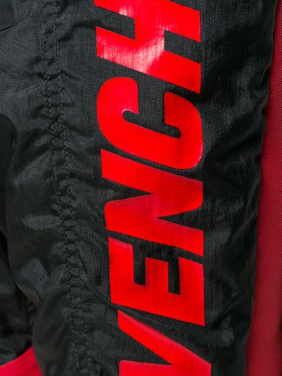 Shop Givenchy Track Style Logo Trousers In Black