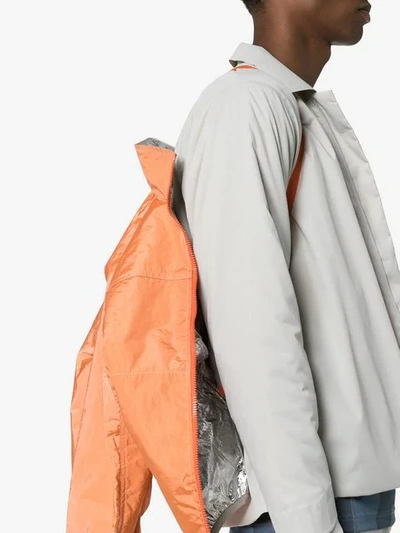 Shop Satisfy Reversible Windbreaker Jacket In Orange