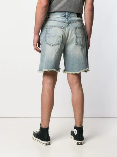 Shop Amiri Thrasher Distressed Denim Shorts In Vintage Indigo