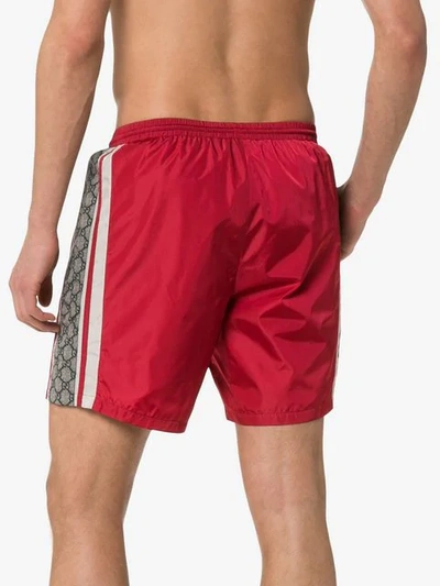 Shop Gucci Monogram Stripe Swim Shorts In Red