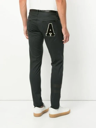 Shop Undercover Letter Patch Skinny Trousers - Black