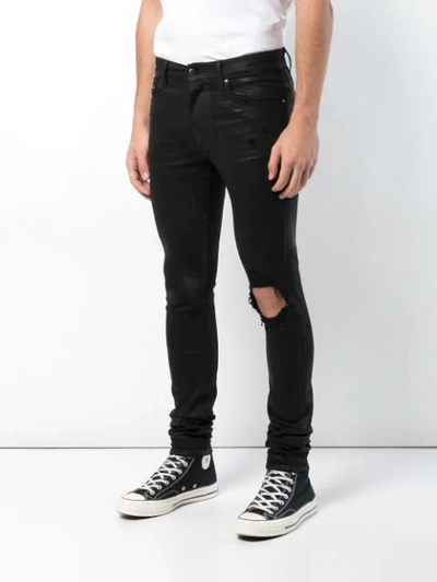 Shop Amiri Regular Jeans - Black