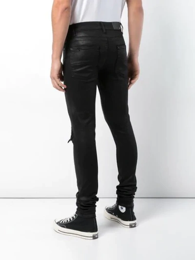 Shop Amiri Regular Jeans - Black