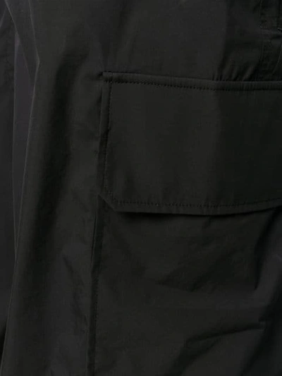 Shop Neil Barrett Tapered Cargo Trousers In Black