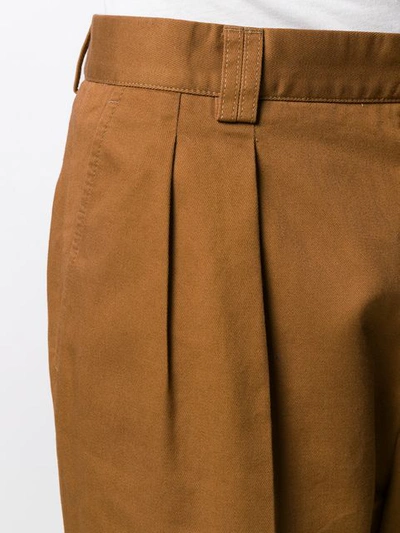 Shop Gucci Pleated Straight-leg Trousers In Brown